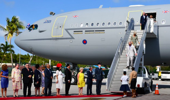 King Charles disembarking plane